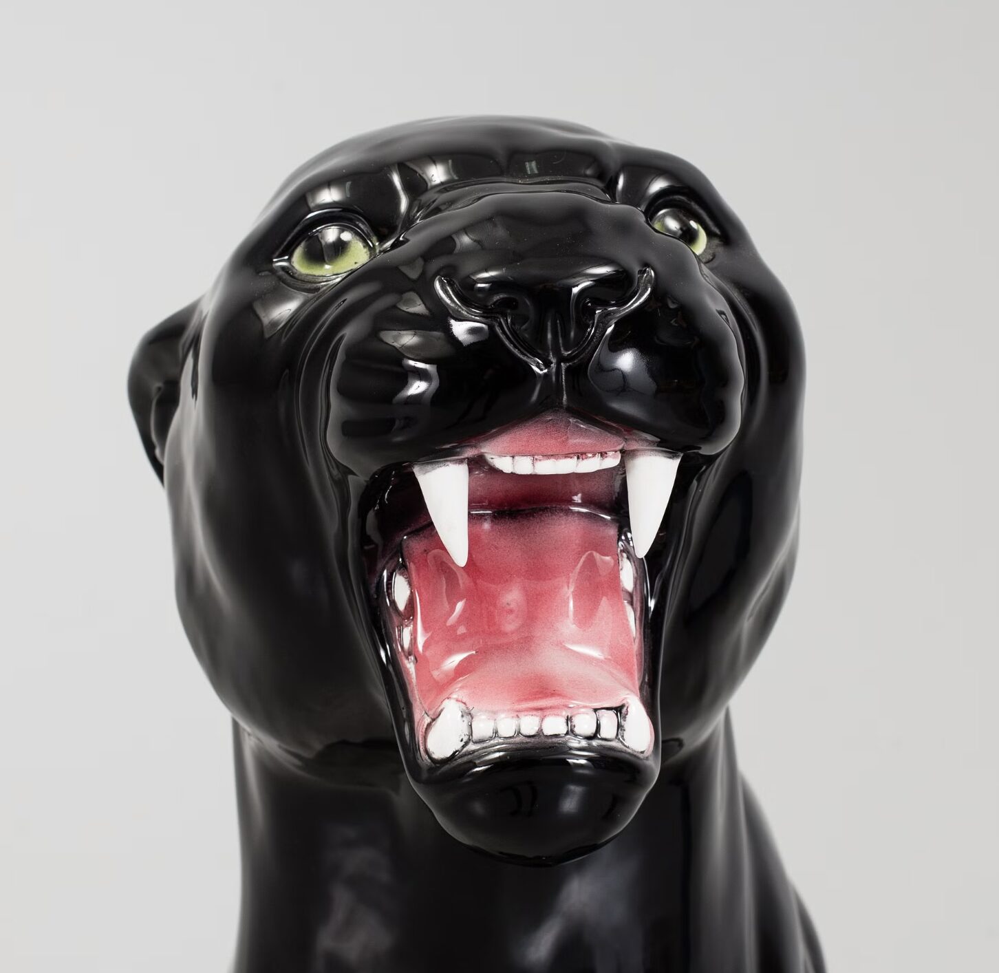 Glossy black ceramic panther sculpture