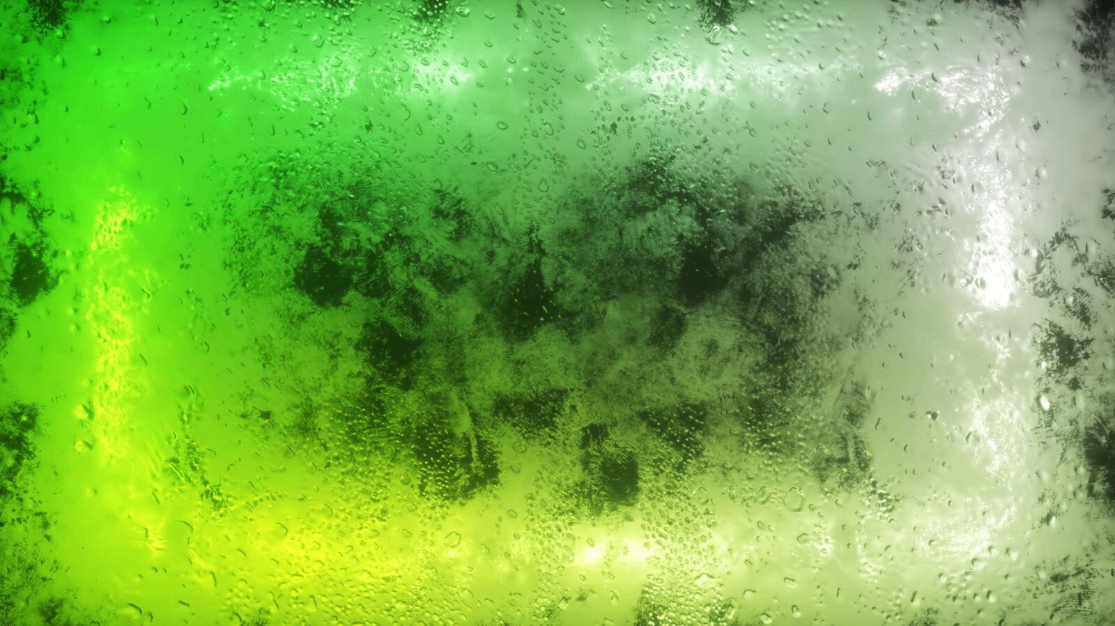 Wet glass with green light